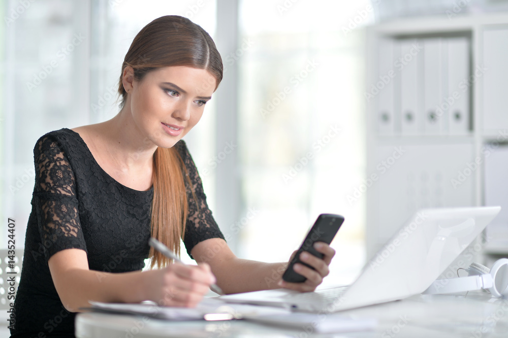 Business woman sitting at table Business woman sitting at table