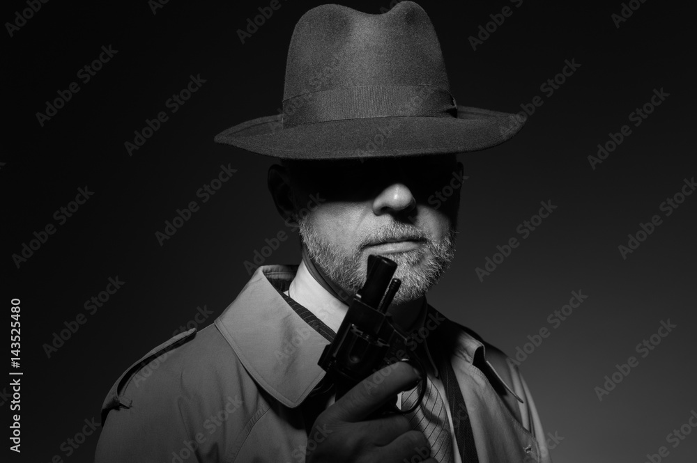 © stokkete - Detective holding a gun in the dark © stokkete - Detective holding a gun in the dark