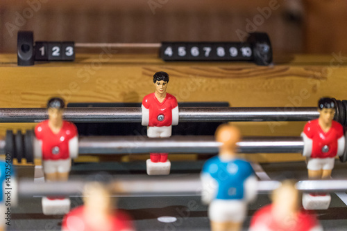 Table football kicker with miniature players