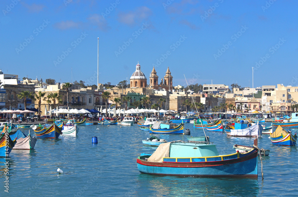 colorful fishing boats in Marsaxlokk, Malta