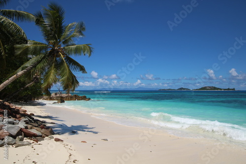 Beach Grand Anse, Anse Kerlan, Praslin Island, Seychelles, Indian Ocean, Africa / The beautiful white sandy beach is bordered by large red granite rocks. © sarlay