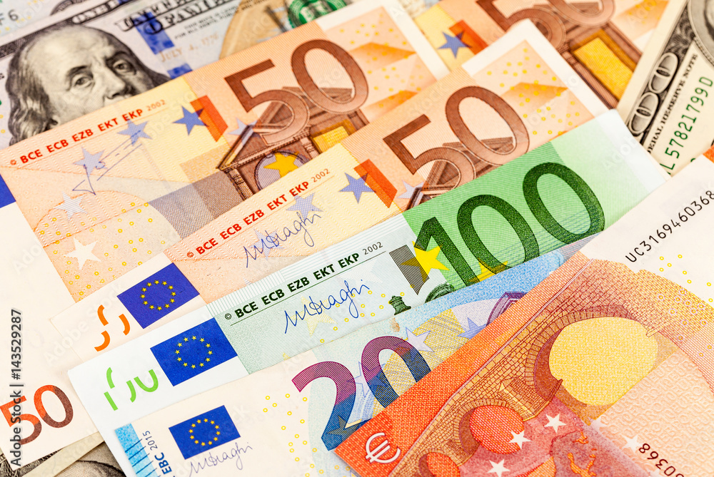 Background of different currency. Euro banknotes and american dollars Background of different currency. Euro banknotes and american dollars
