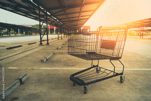 Shopping cart in parking lot.