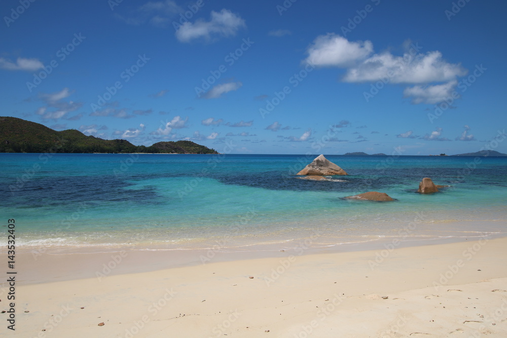 Anse Boudin Beach, Praslin Island, Seychelles, Indian Ocean, Africa / The beautiful white sandy beach is bordered by large red granite rocks. 