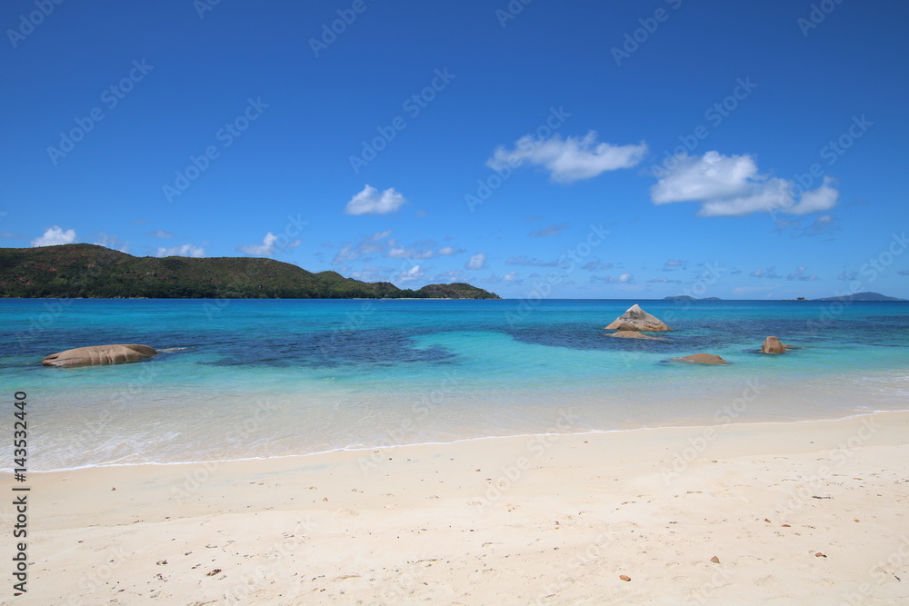 Anse Boudin Beach, Praslin Island, Seychelles, Indian Ocean, Africa / The beautiful white sandy beach is bordered by large red granite rocks. 