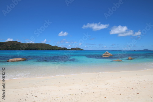 Anse Boudin Beach  Praslin Island  Seychelles  Indian Ocean  Africa   The beautiful white sandy beach is bordered by large red granite rocks. 