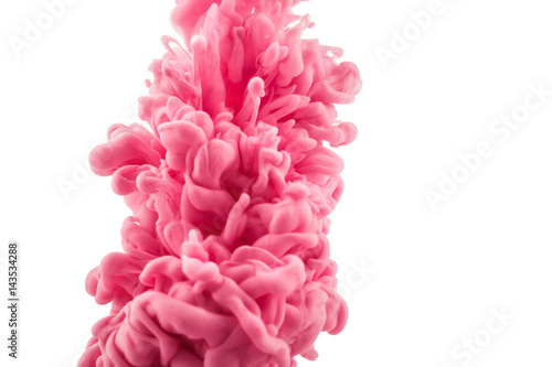colorful ink isolated on white background. pink drop swirling under water. Cloud of ink in water. 
