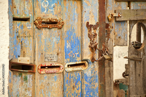 Letterboxes in distressed door photo