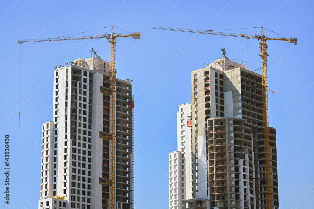 Two skyscrapers and cranes Two skyscrapers and cranes