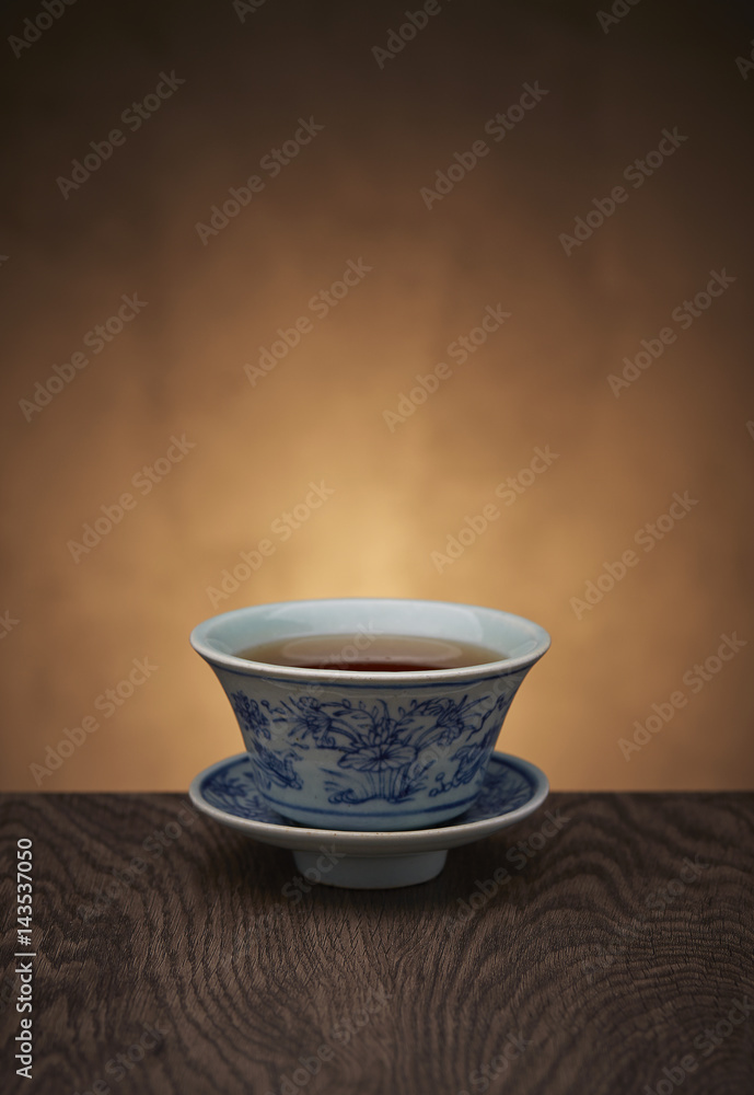 Traditional tea ceremony accessories, teacup with wooden background