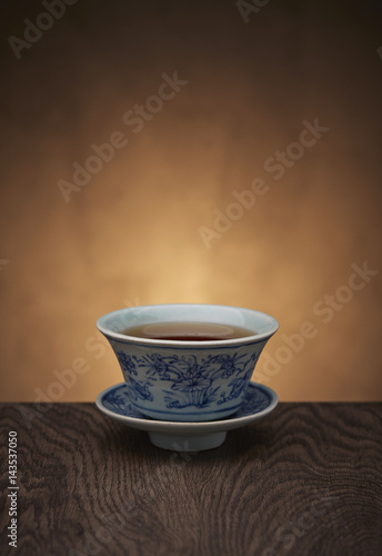 Traditional tea ceremony accessories, teacup with wooden background