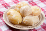 Cooked and peeled potatoes served on the plate