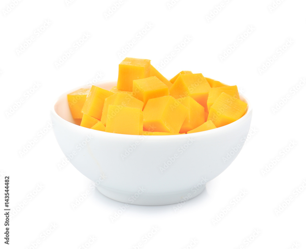 Delicious pieces of cheddar in bowl on white background