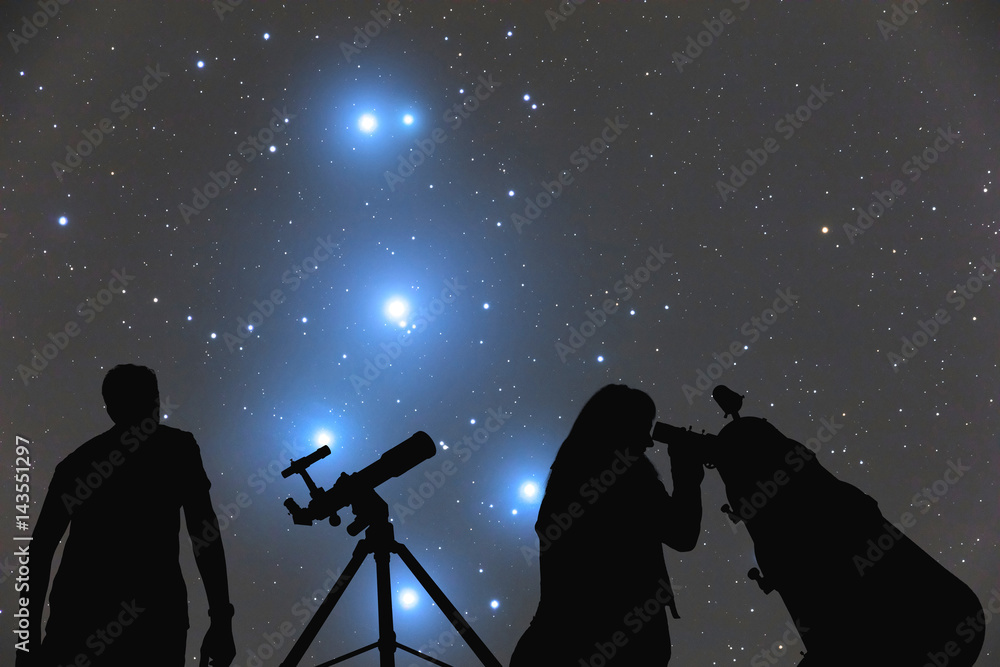 Couple looking at the stars with telescopes. My astronomy work.