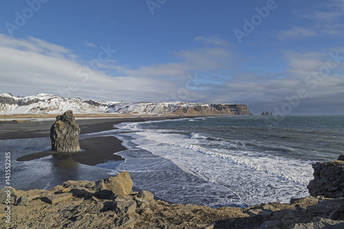 Iceland, Vik, black beach and eastward view towards Reynisdrangar