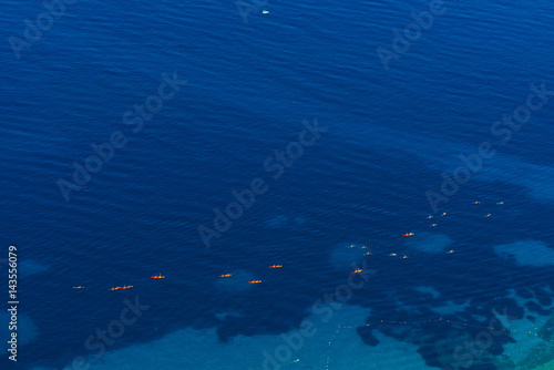 Kayaks at sea. Tourist kayaking in the sea near Dubrovnik, Croatia. Aerial Photo drone.