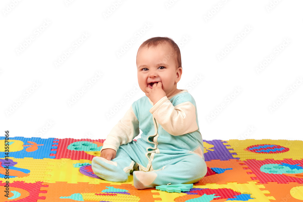 baby girl playing wooden toy blocks isolated on Soft mat baby girl playing wooden toy blocks isolated on Soft mat