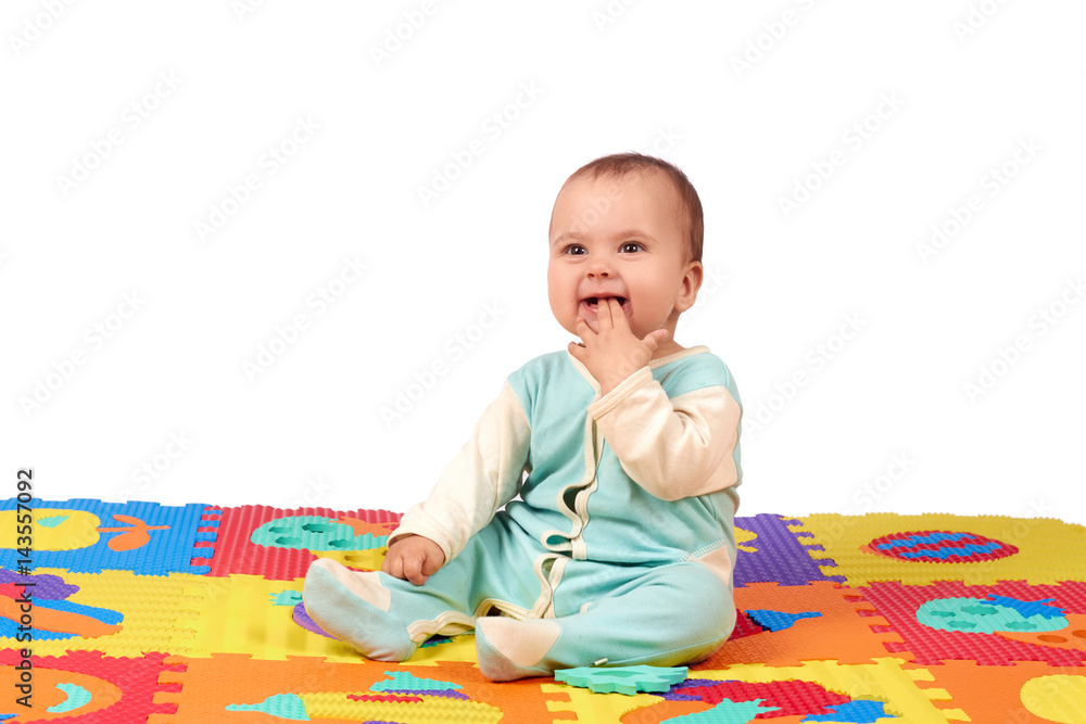 baby girl playing wooden toy blocks isolated on Soft mat baby girl playing wooden toy blocks isolated on Soft mat