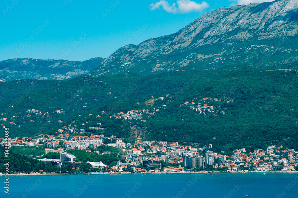 Herceg Novi, the view from the shore on the contrary, against the background of mountains and sky, Montenegro, Adriatic
