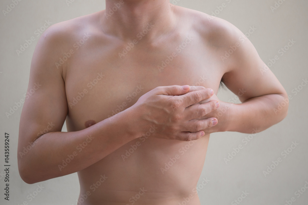Man holding breast because of heart infarction. Man holding breast because of heart infarction.