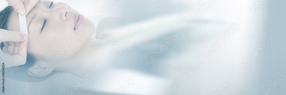 Hand waxing beautiful womans eyebrow Hand waxing beautiful womans eyebrow