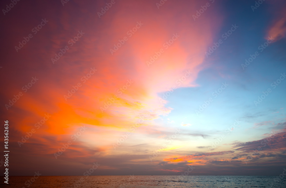 Burning clouds and tropical sea after the sun is set Burning clouds and tropical sea after the sun is set