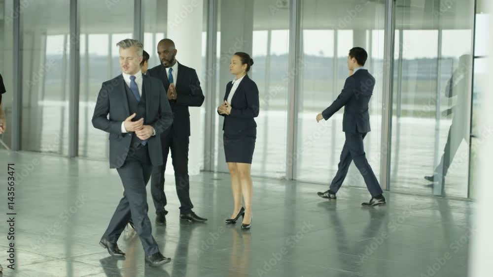 Business people chatting in busy modern office Business people chatting in busy modern office