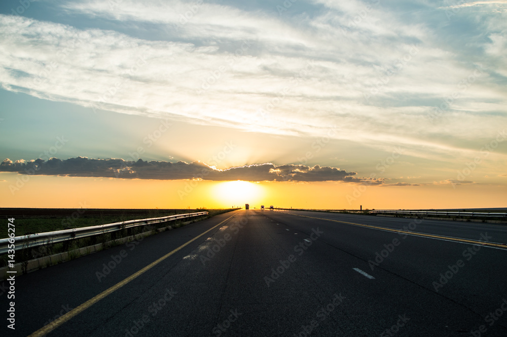 Driving into the Sunset on a Highway, Free State, South Africa