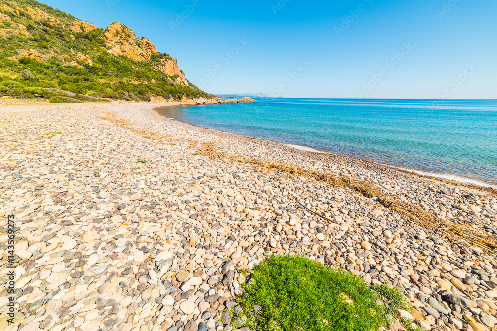 Pebbles and blue sea in Baccu e Praidas beach,