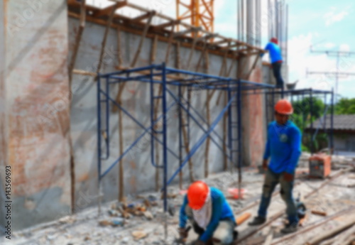 blur focus of worker in construction site workplace building