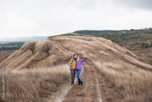 Couple taking selfie on rural path