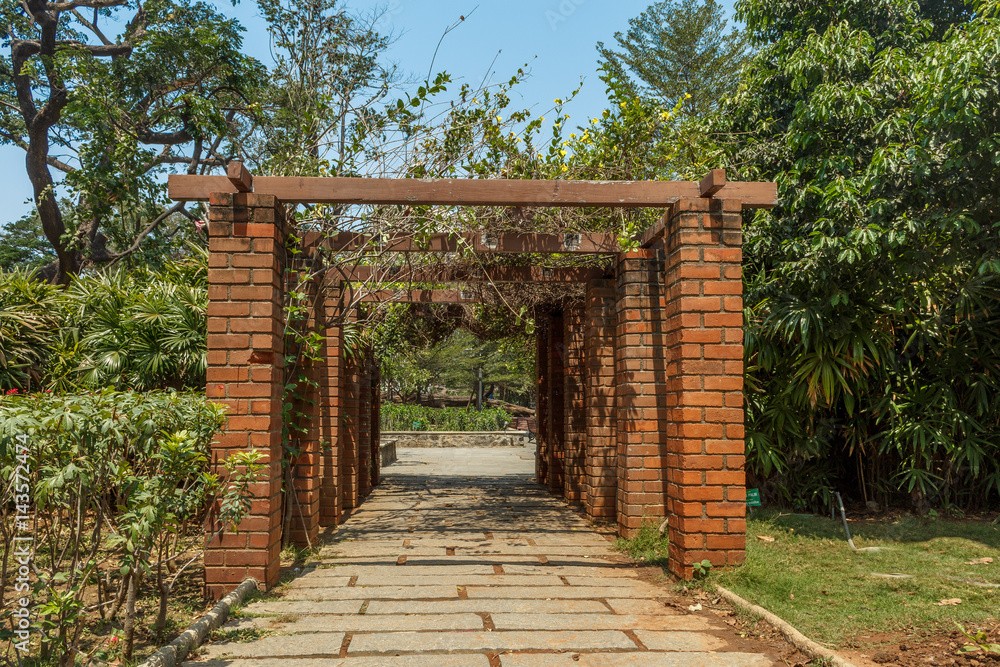 View of red brick pillar pathway in a garden, Chennai, India, April 1st 2017 View of red brick pillar pathway in a garden, Chennai, India, April 1st 2017