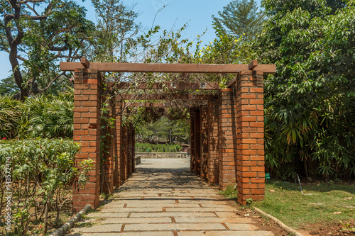 View of red brick pillar pathway in a garden, Chennai, India, April 1st 2017