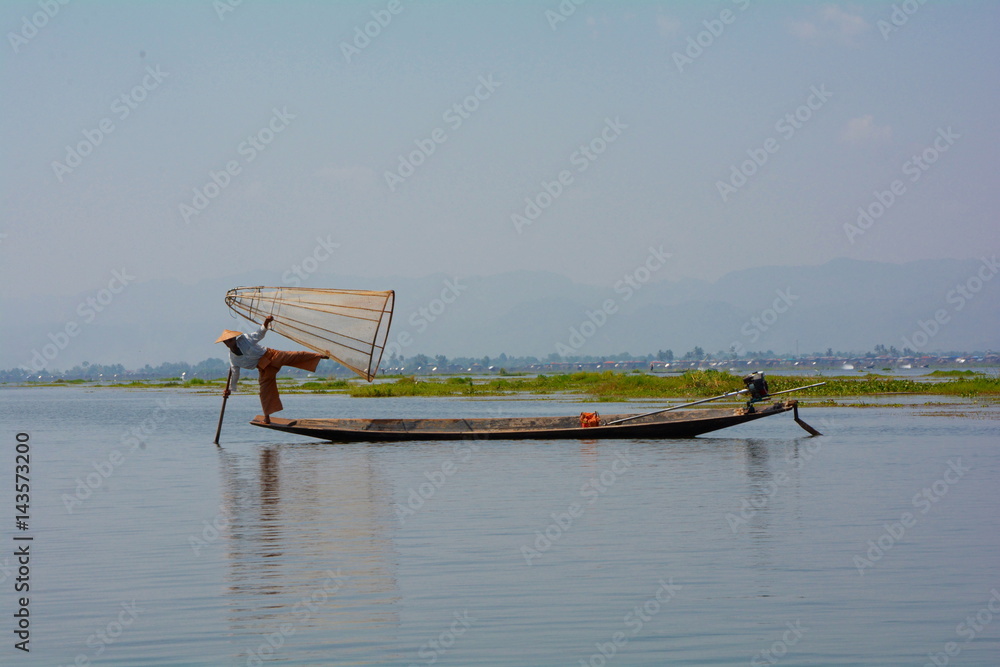 Fisherman in the boat, Inle, Myanmar Fisherman in the boat, Inle, Myanmar