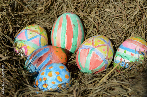 Painted easter eggs in a nest.