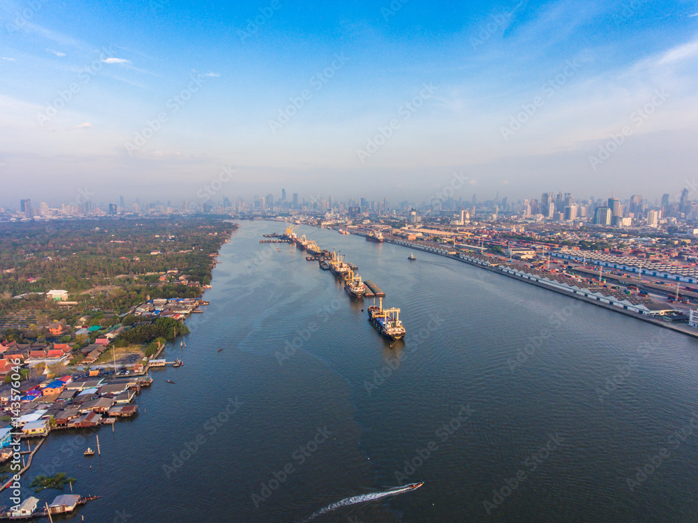 Obraz premium Aerial view of industrial port with containers