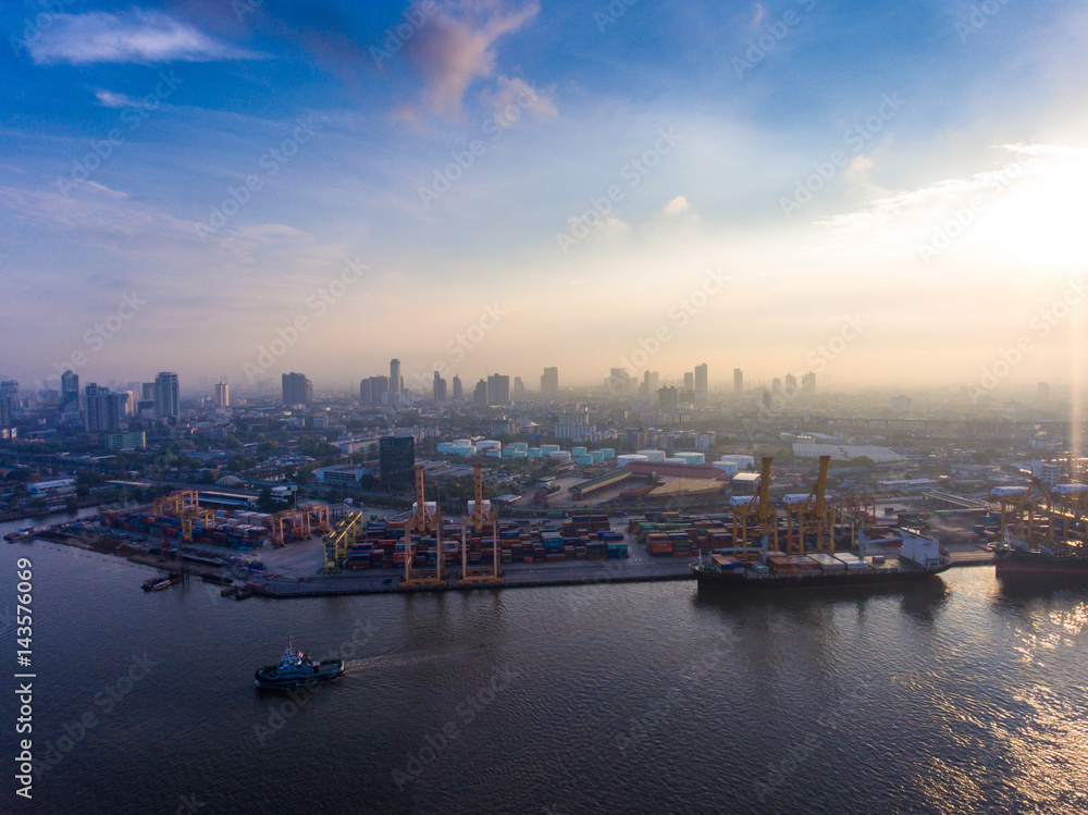 Naklejka premium Aerial view of industrial port with containers