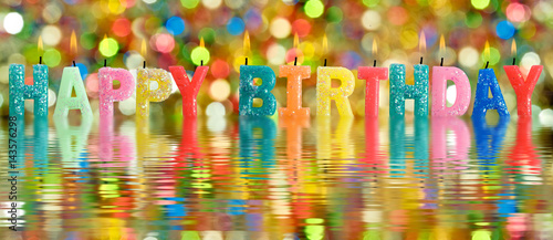 Canvas Print Glowing candles on water background