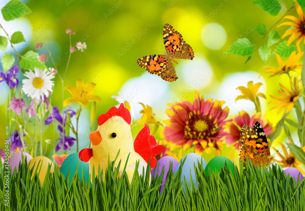 Image of toy chick and Easter eggs in grass close up