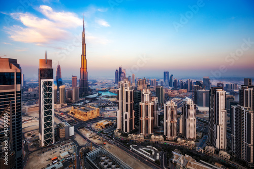 Spectacular aerial view of Dubai  UAE  at sunset. Colourful skyline of a big modern city. Travel background.