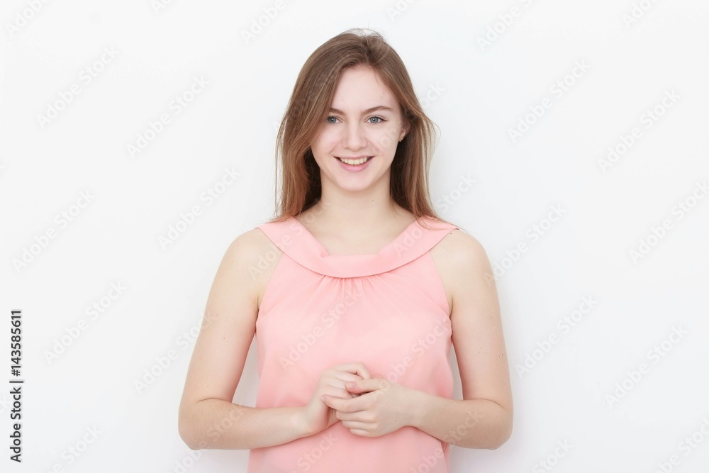 Young casual woman In pink blouse isolated over white background studio portrait Young casual woman In pink blouse isolated over white background studio portrait