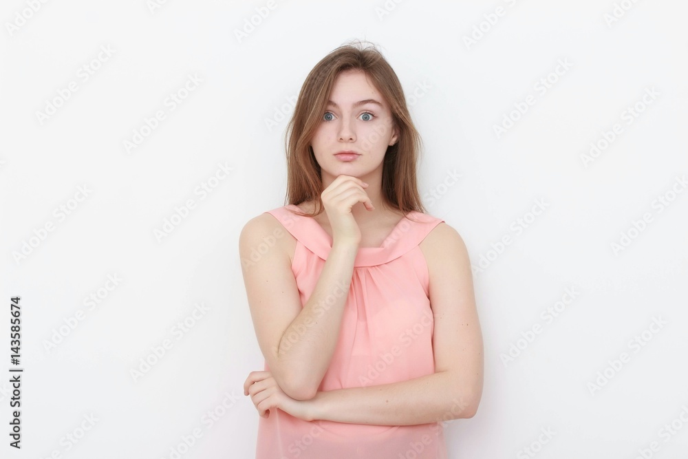 Young casual woman In pink blouse isolated over white background studio portrait Young casual woman In pink blouse isolated over white background studio portrait