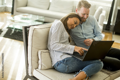 Young couple sitting on a s...