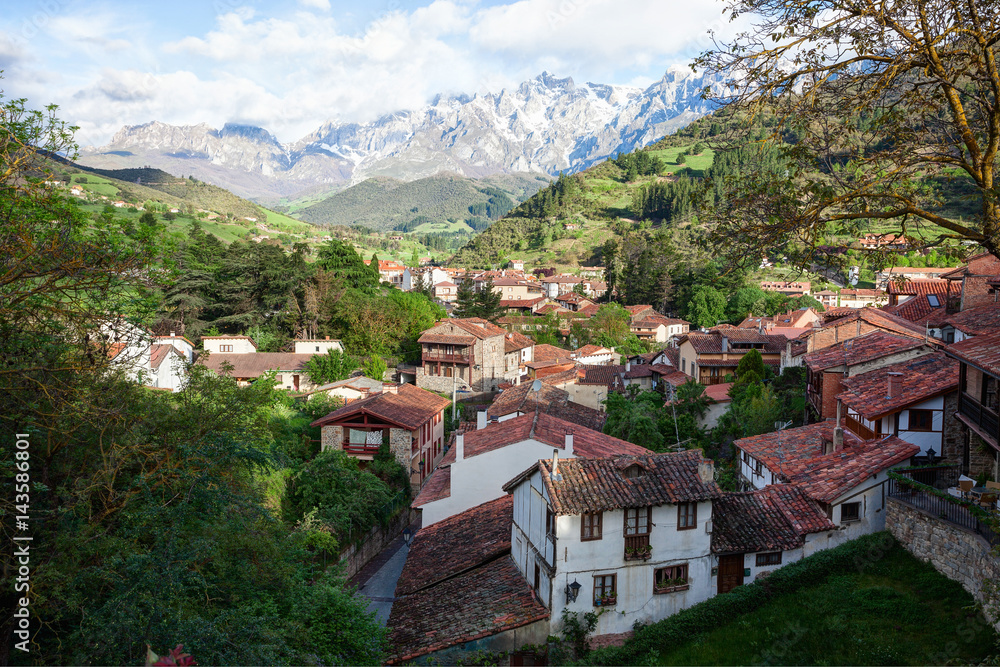 The town of Potes at  a sunny morning on a background of mountains, Cantabria,  Spain.