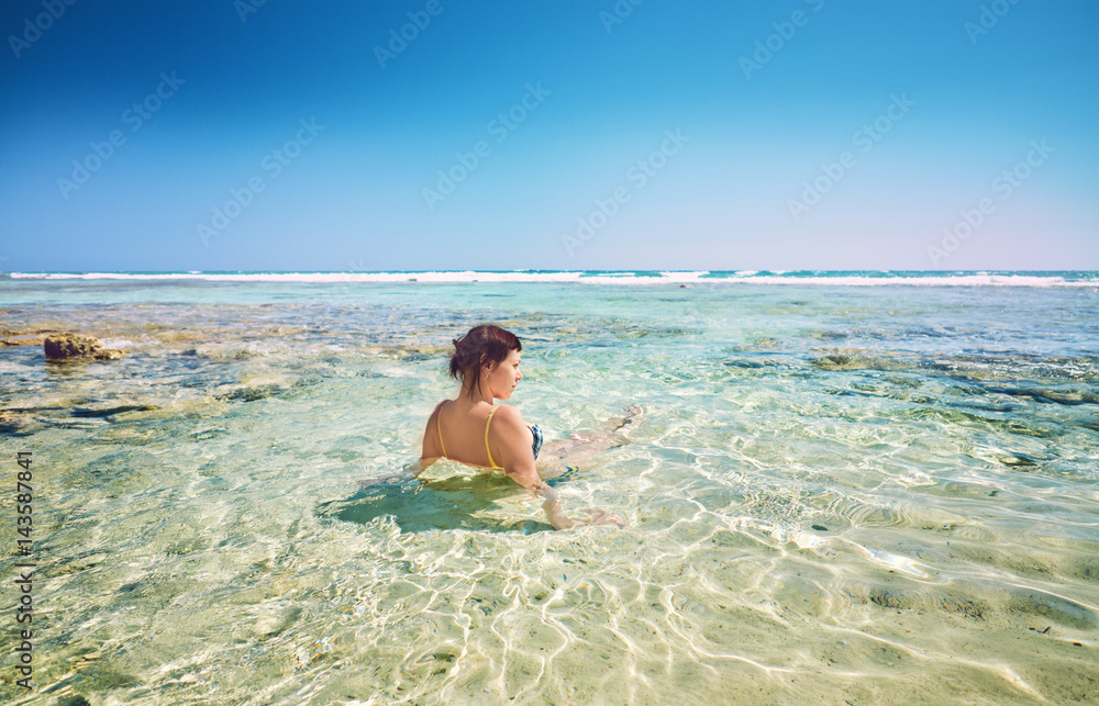 Young woman on beach cheerful joyful coconut palm trees. Beach Caribbean Sea, Cuba