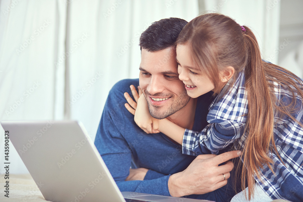 Girl is hugging her dad 