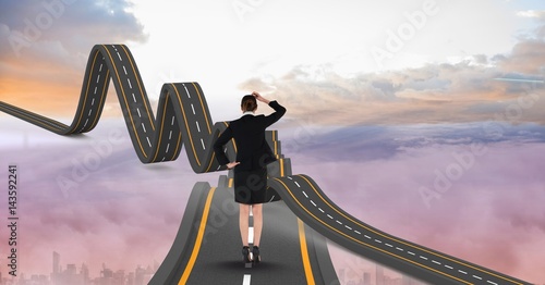 Digitally generated image of businesswoman on wavy road in sky