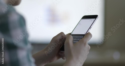 Woman hands texting, using smartphone in office