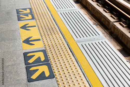 Blind floor tiles on train station platform