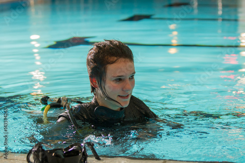scuba diving course pool teenager girl with instructor 